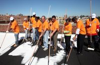 Mayor Bloomberg painting the millionth square foot of roof white in the Bronx